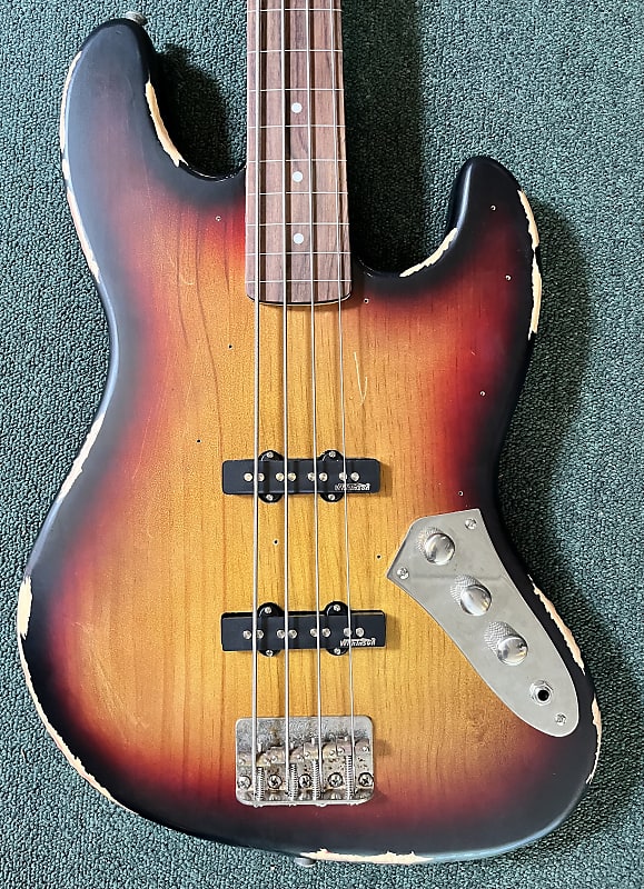 Басс гитара Vintage VJ74 Icon Series Fretless Bass - Distressed Matte Sunset цена и фото