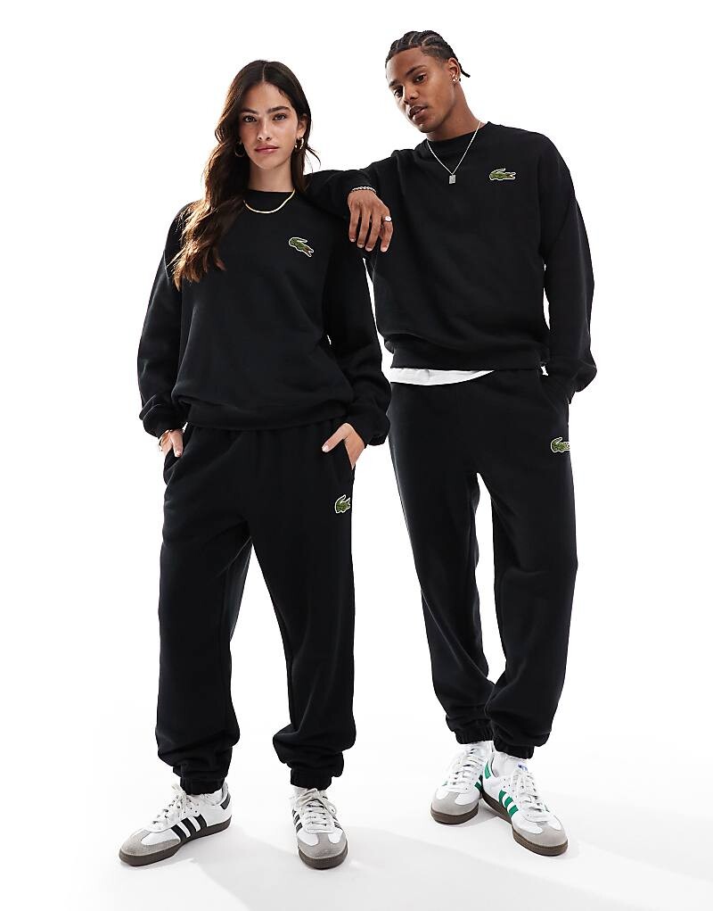 

Lacoste – черные спортивные штаны унисекс с логотипом