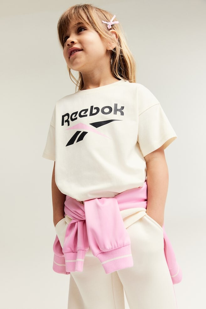 

Футболка оверсайз с принтом H&M, белый