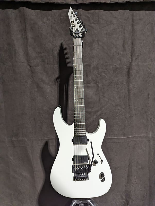 

Электрогитара ESP LTD M-1000 Deluxe Snow White Solid Body Electric Guitar