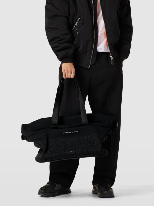 

Модель Weekender с детальной этикеткой Porsche Design Evoknit Puma, черный