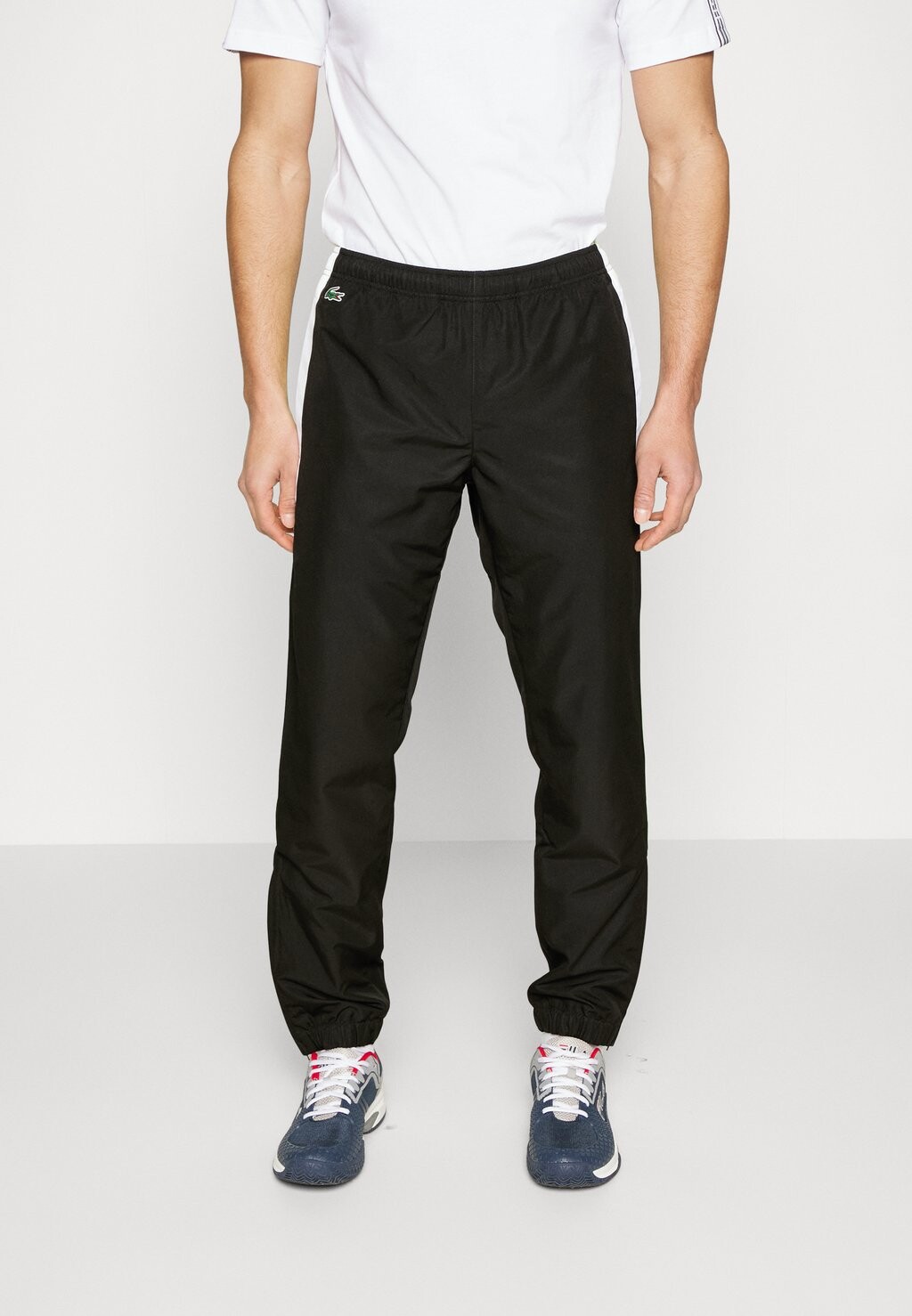 

Спортивные брюки Lacoste