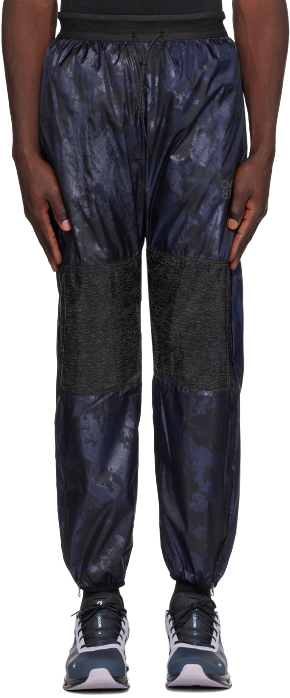 цена Темно-синие спортивные брюки OVER OVER со вставками