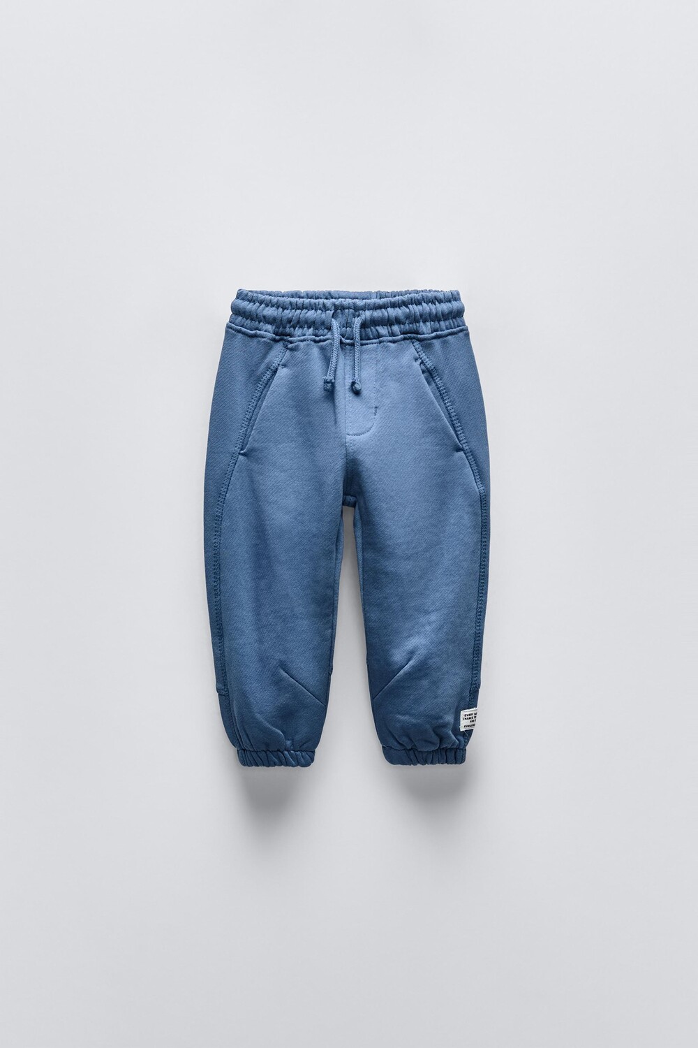 

Плюшевые брюки с аппликациями-этикетками ZARA, выцветший синий