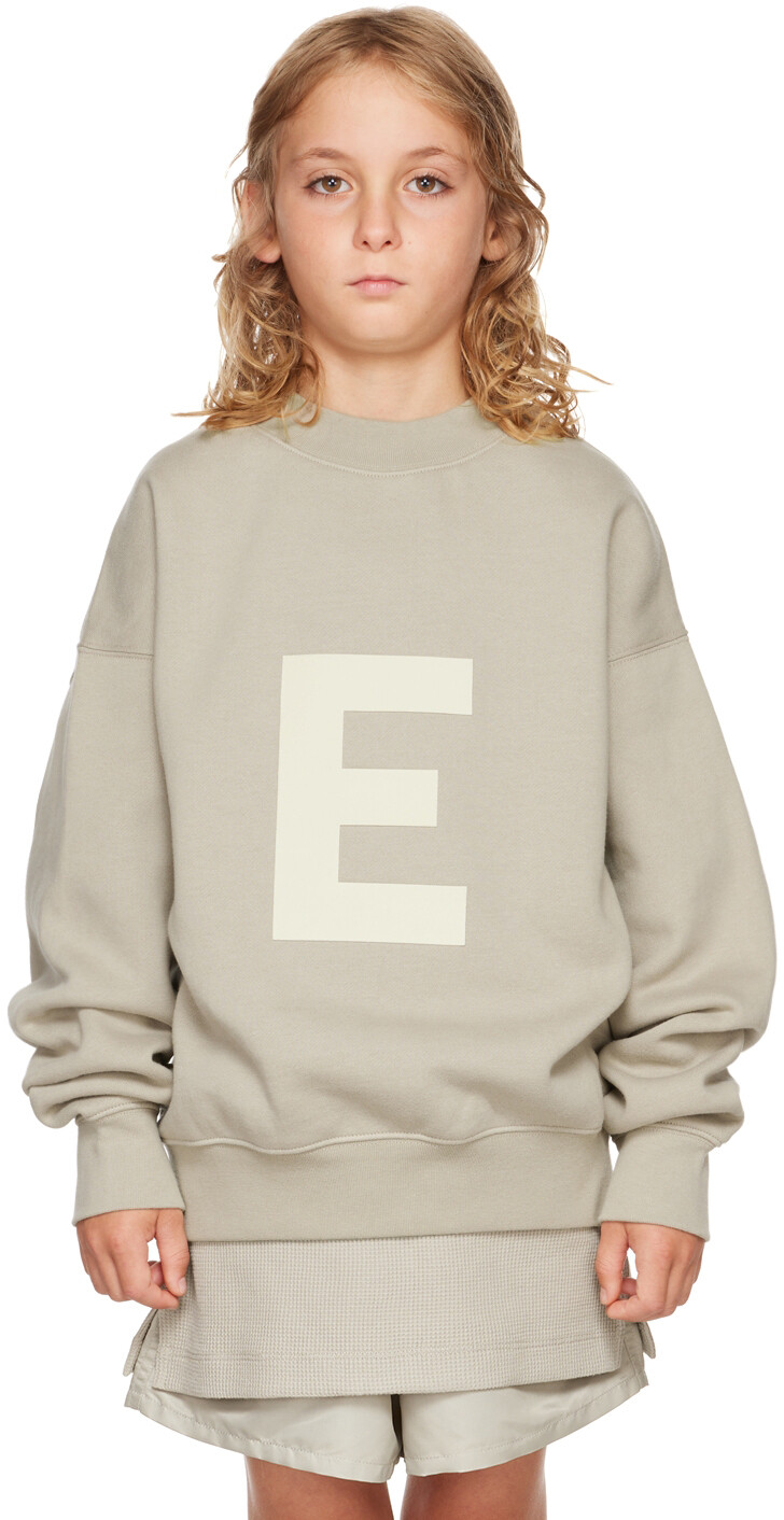 

Детский серый свитшот с логотипом Fear of God ESSENTIALS