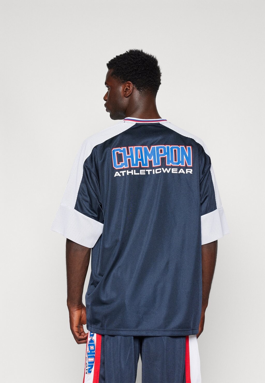 

Принт на футболке RETRO SPORT LOOSE CREWNECK BACKPRINT Champion, темно-синий