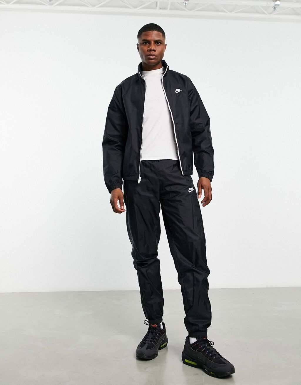 

Черный плетеный спортивный костюм Nike Club