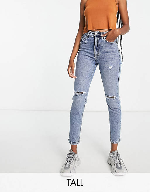 

Джинсы эластичного и рваного кроя Stradivarius Tall настоящего синего цвета.