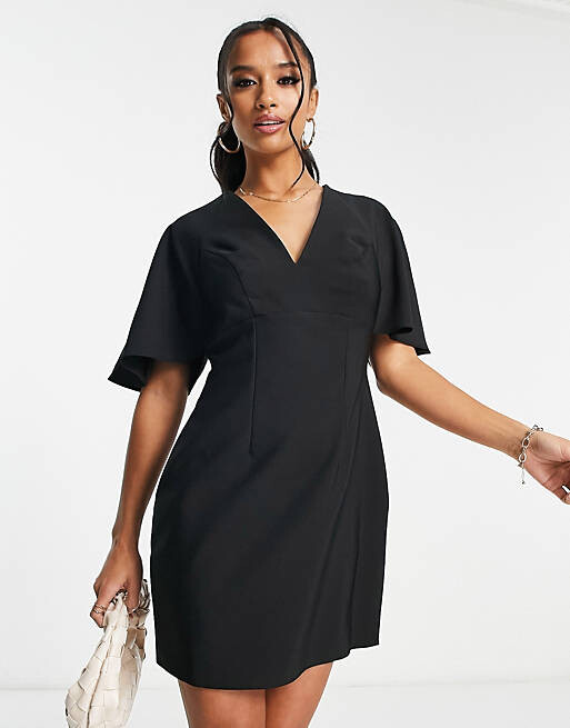 

Черное платье мини с v-образным вырезом и рифлеными рукавами ASOS DESIGN Petite, Черный