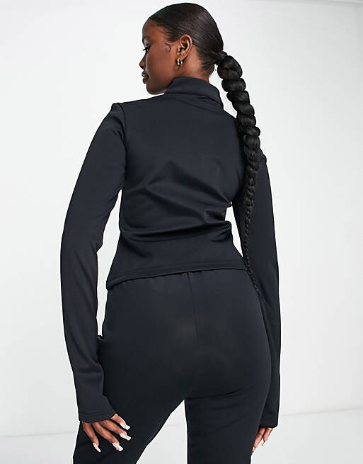 

Черный топ с длинными рукавами Missguided Ski