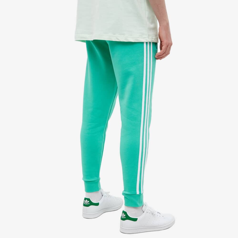 3 stripes pants. Adidas adicolor 3-stripes cargo black. green pants.