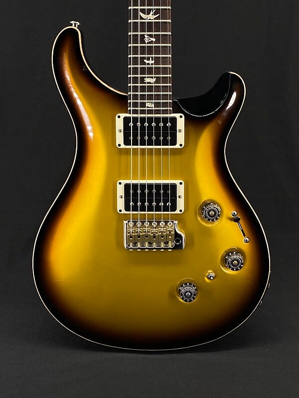 

PRS Custom 24 Piezo в металлическом золотом взрыве Custom 24 Piezo in Metallic Gold Burst