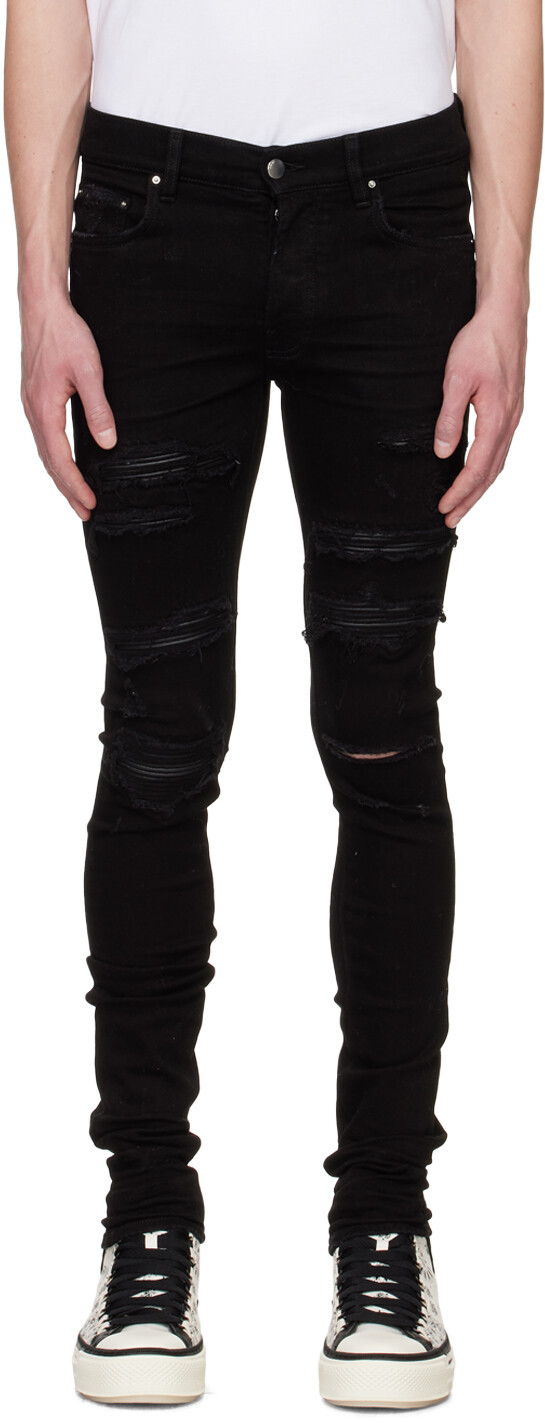 

Черные рваные джинсы AMIRI