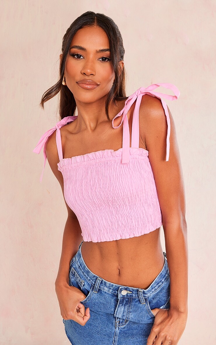 

PrettyLittleThing Укороченный топ с хлопковыми гофрированными рукавами и завязками розового цвета Baby Pink
