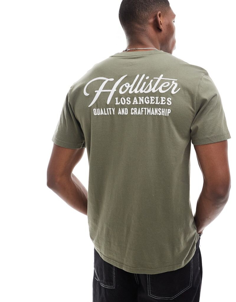 

Hollister - Оливково-зеленая футболка с принтом на спине
