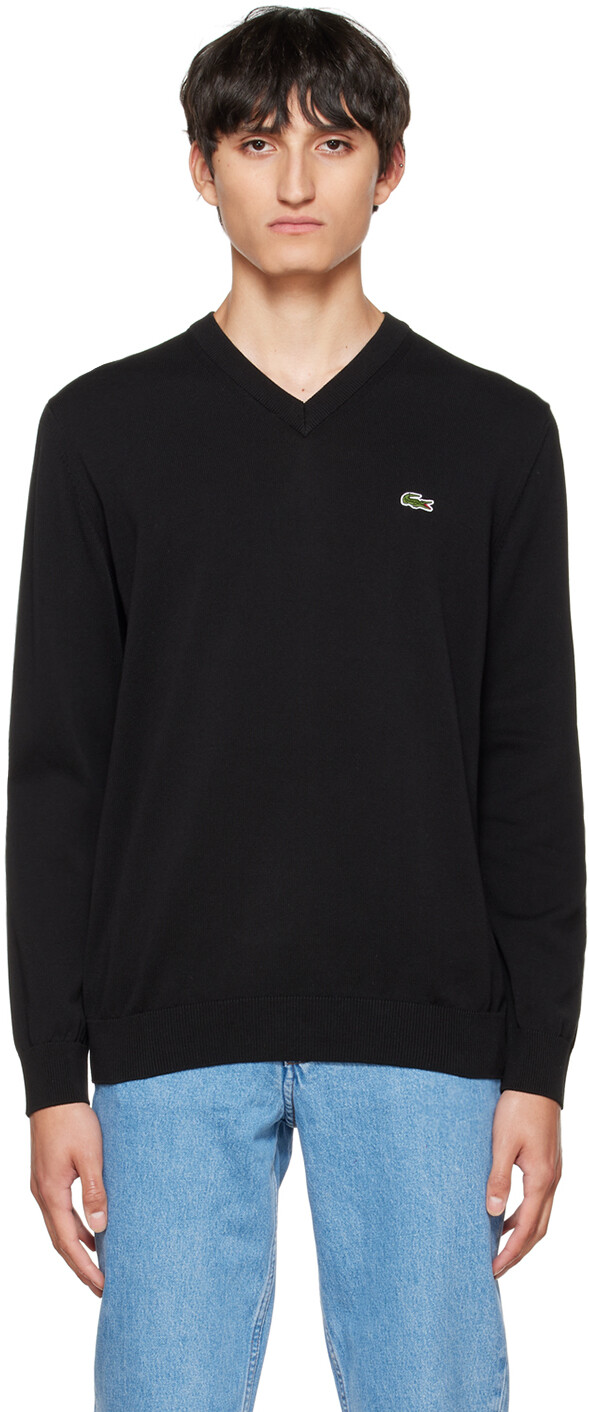 

Черный свитер с нашивками Lacoste