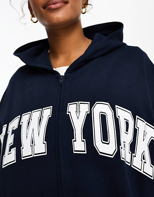 

Темно-синее худи на молнии с изображением Нью-Йорка ASOS DESIGN Curve