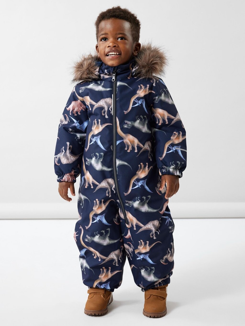 

Зимний комбинезон NMMSNOW10 DINO DREAM UNISEX Name it, цвет dark sapphire