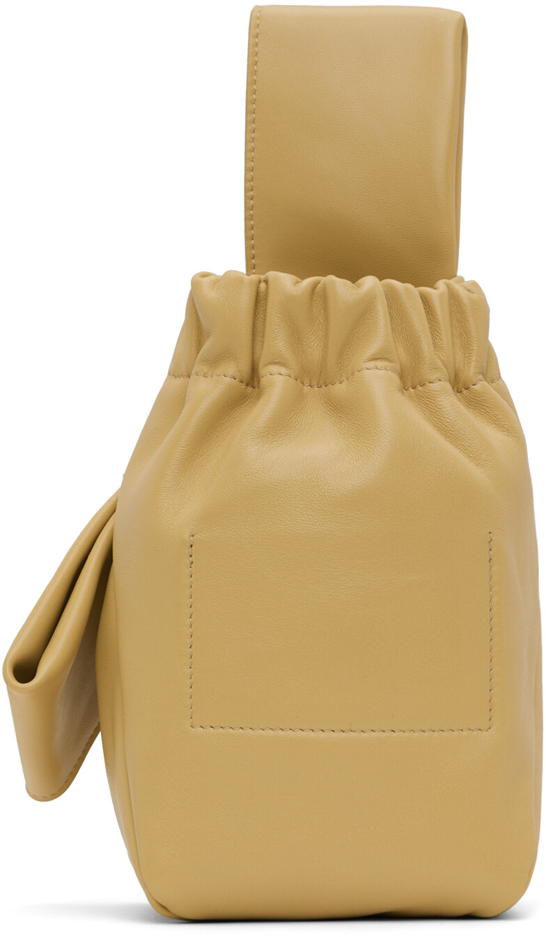 

Бежевый клатч с бантом Jil Sander