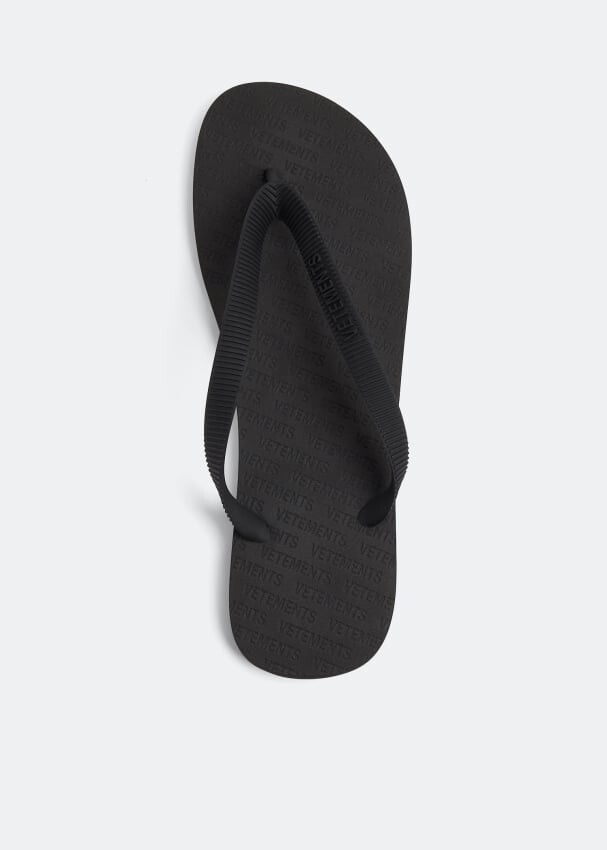 

Шлепанцы VETEMENTS Logo flip flops, черный