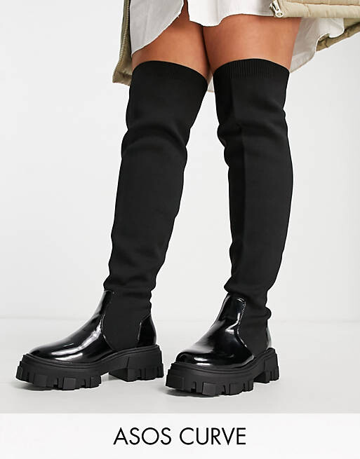 

Черные массивные ботфорты на плоской подошве ASOS DESIGN Curve Kimmy