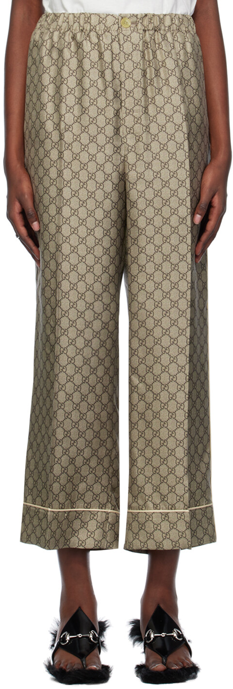 

Коричневые брюки Supreme с узором GG Gucci