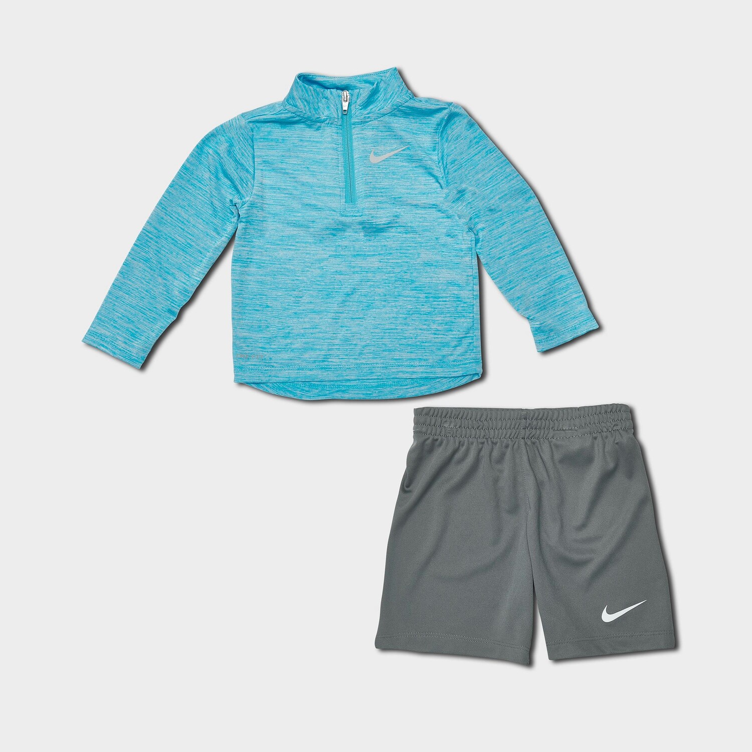 

Комплект из топа и шорт с молнией на четверть Nike Dri-FIT для младенцев, синий