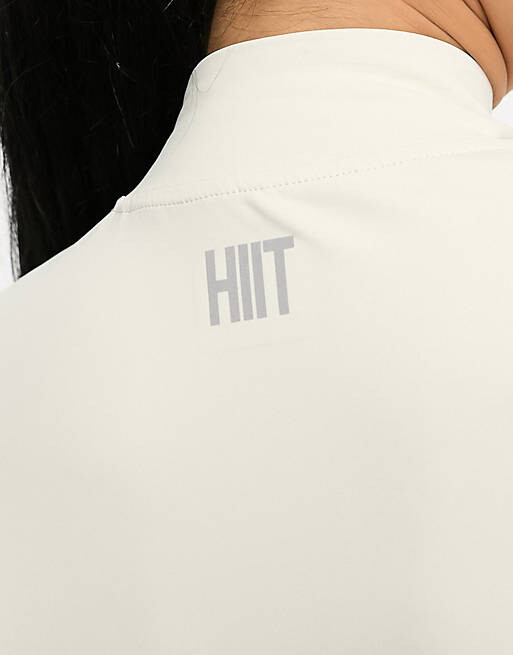 

Укороченный топ HIIT цвета экрю с молнией 1/4