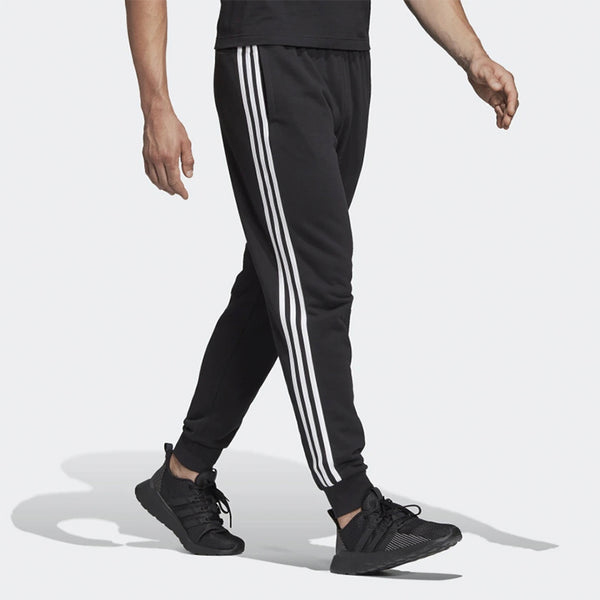 Adidas essentials store logo cuffed pants