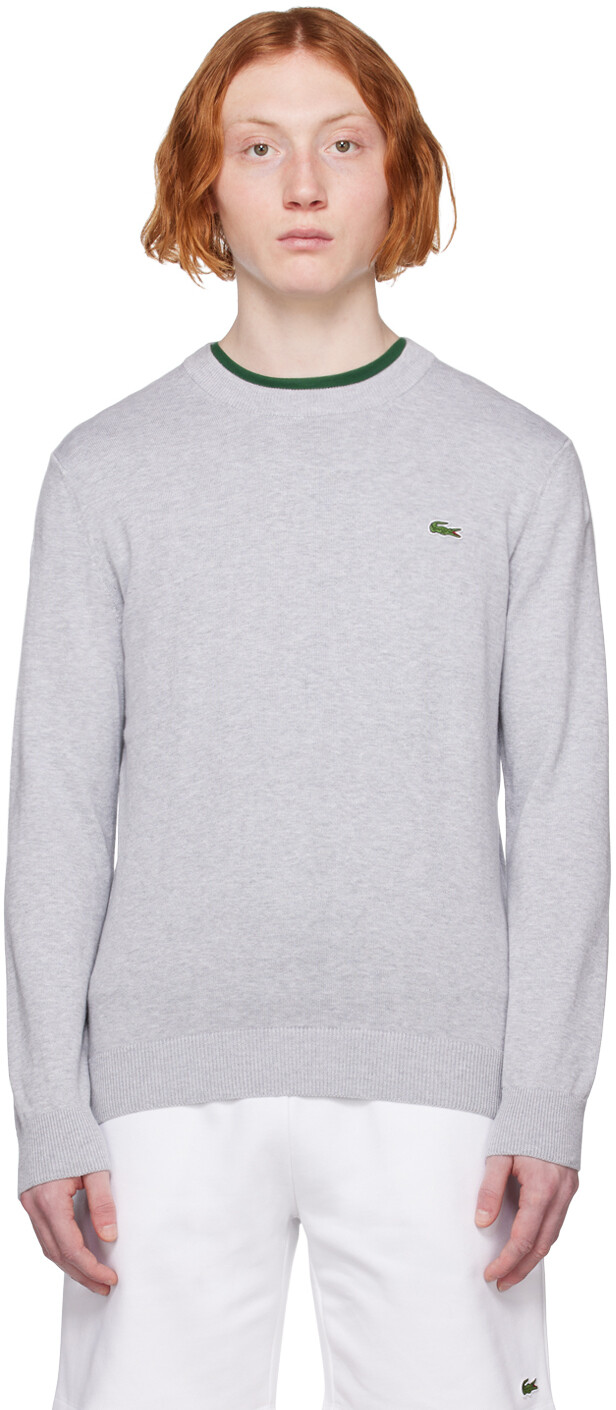 

Серый свитер с нашивками Lacoste