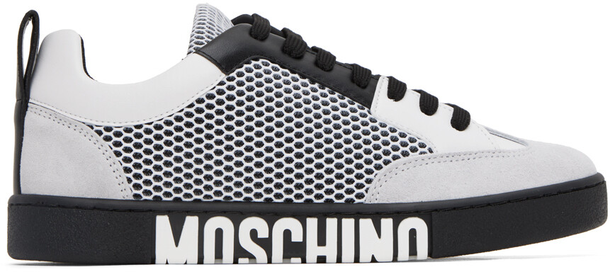 

Бело-черные кроссовки с боковым логотипом Moschino