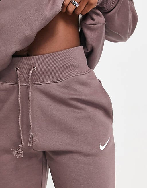 

Сливовые джоггеры Nike Midi Swoosh