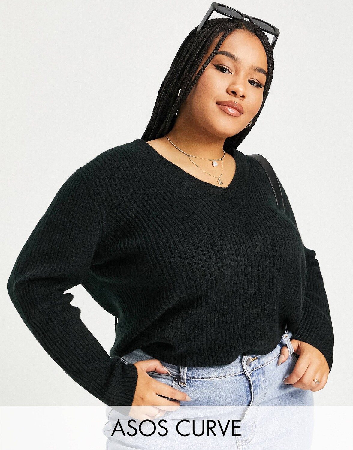 

Черный джемпер свободного кроя с v-образным вырезом в рубчик ASOS DESIGN Curve