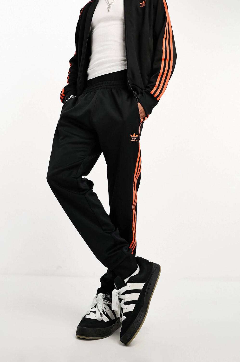 

Брюки Adidas Originals Adicolor Tracksuit Joggers, черный/оранжевый