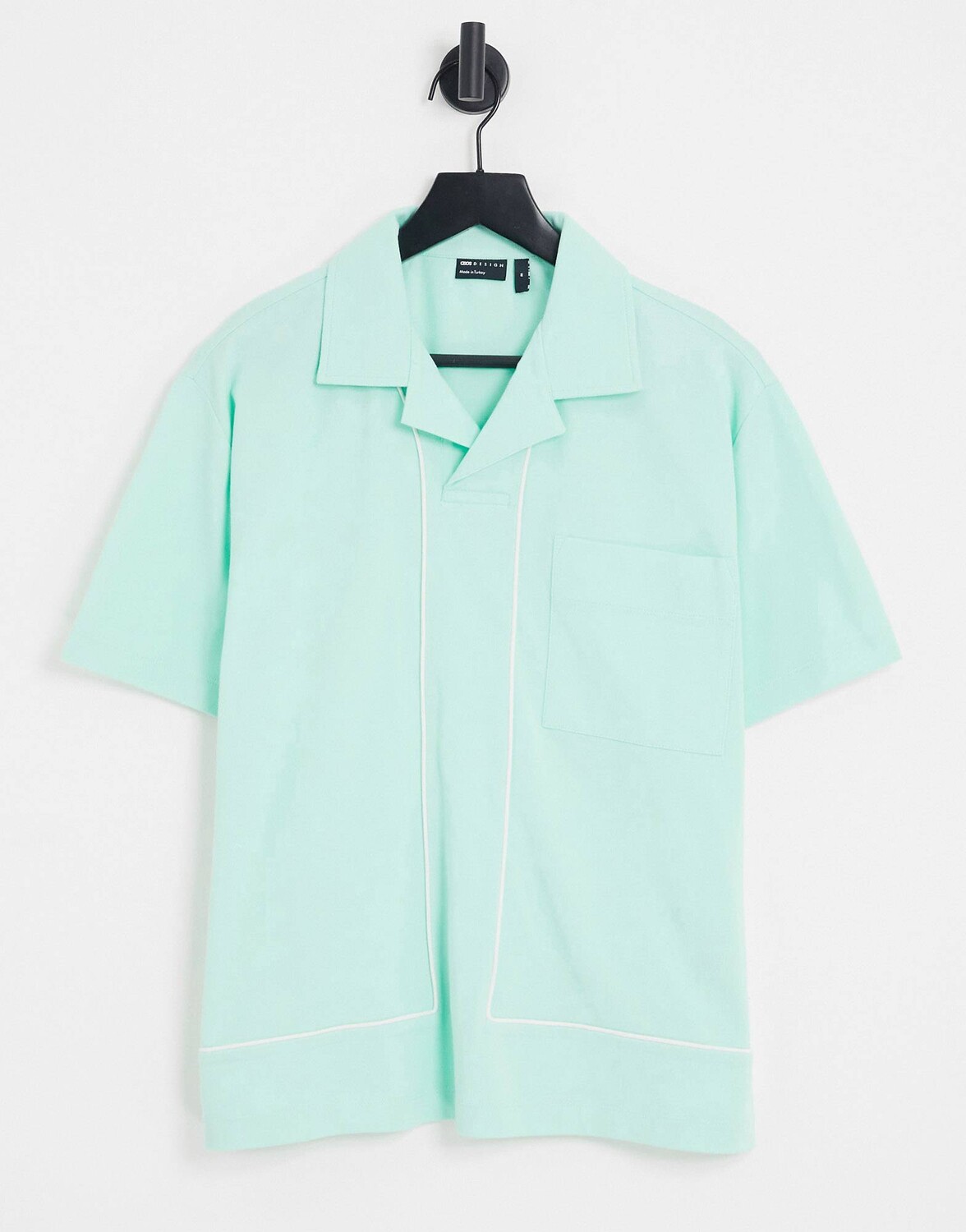 

Зеленое поло свободного кроя из пике с белым кантом ASOS DESIGN