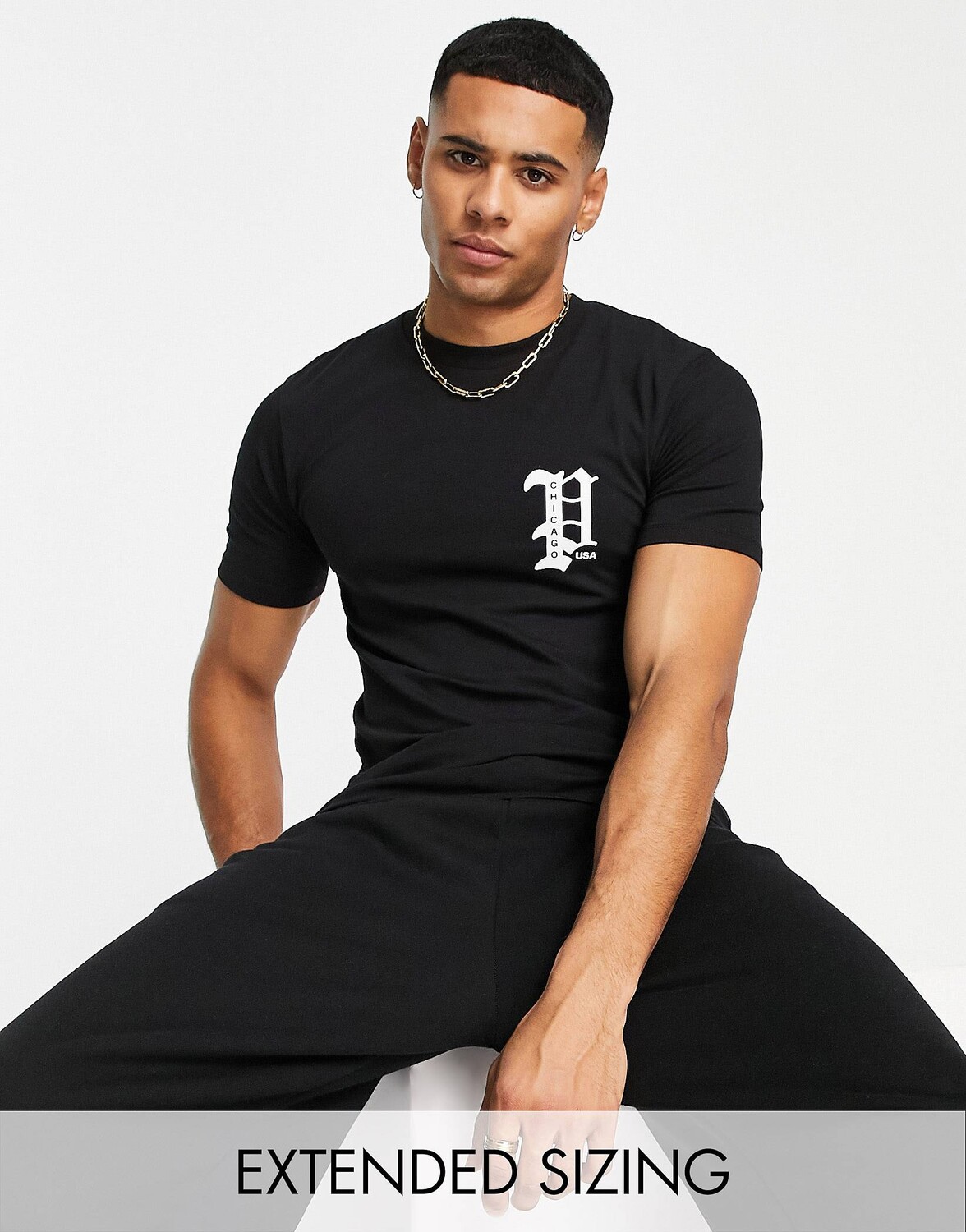 

Черная футболка с принтом на груди города Копенгаген ASOS DESIGN