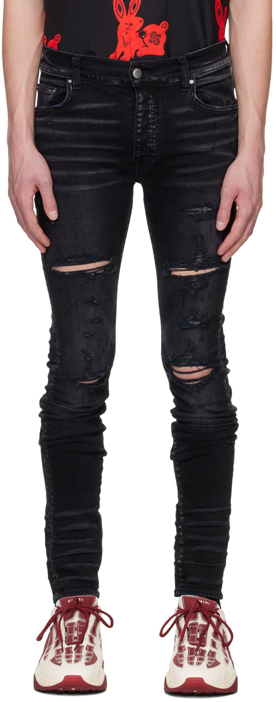 

Черные рваные джинсы AMIRI