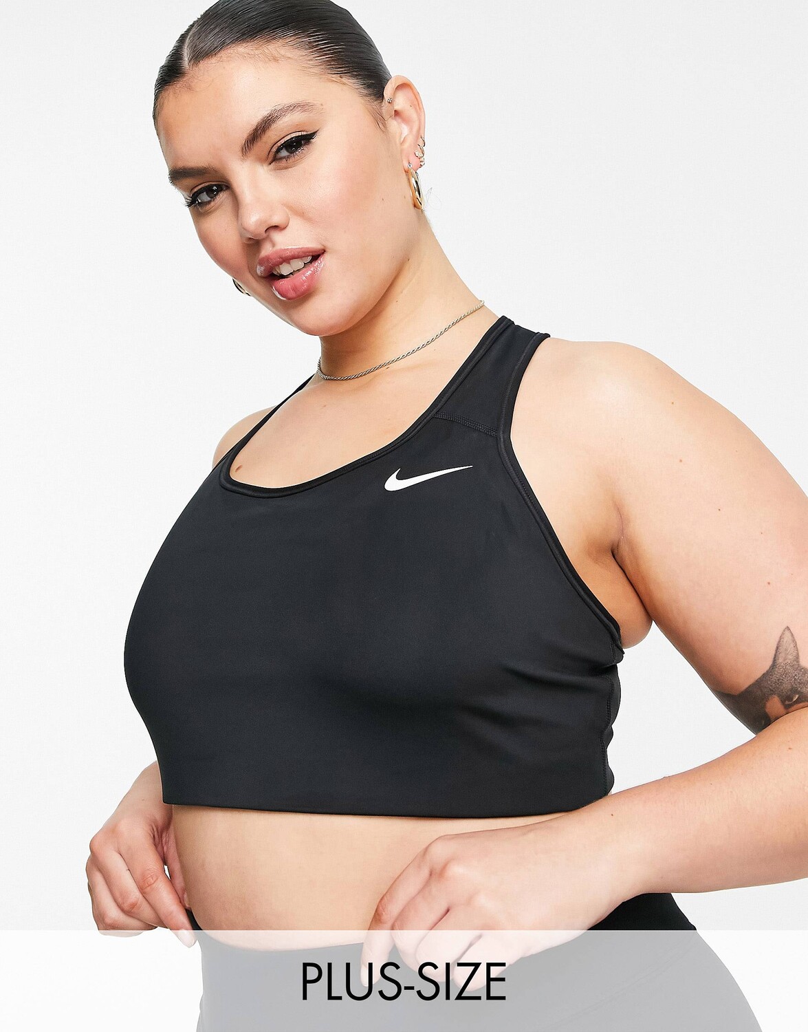 

Черный бюстгальтер без уплотнителя с логотипом Nike Training Plus