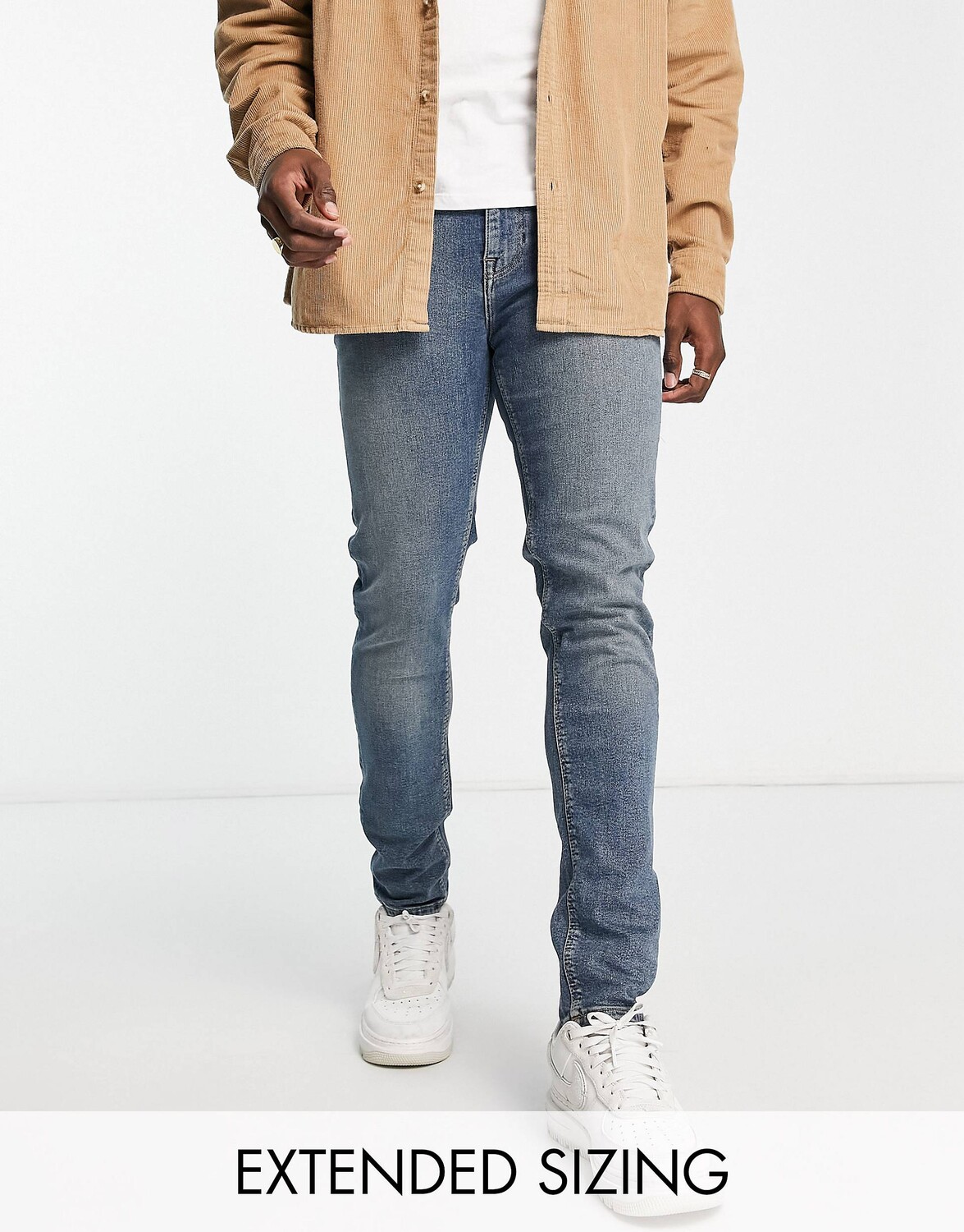 

Темно-синие джинсы скинни с отливом ASOS DESIGN