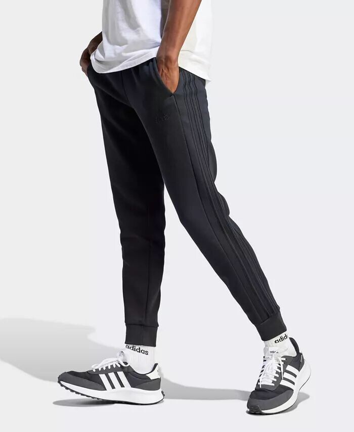 

Мужские тренировочные брюки Essentials с 3 полосками и зауженными манжетами adidas, черный