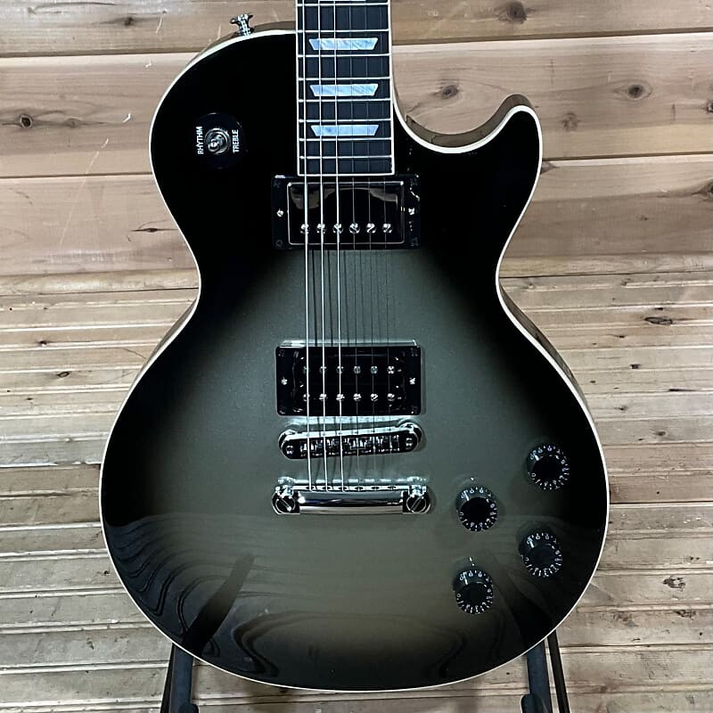 

Gibson Adam Jones Les Paul Standard Электрогитара - Silverburst Adam Jones Les Paul Standard Electric Guitar - Silverburst