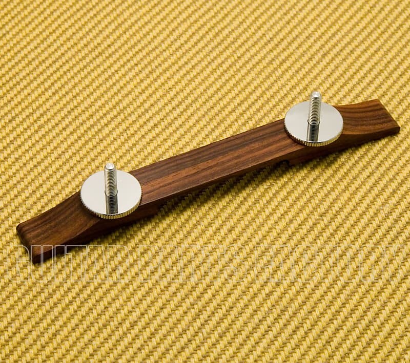 008 0631 000 база гитарного бриджа gretsch ebony и никелевые колесики 008 0631 000 gretsch ebony guitar bridge base and nickel thumbwheels 008-0620-200 Оригинальное основание бриджа Gretsch из палисандра с хромированными колесами и шпильками 008-0620-200 Genuine Gretsch Rosewood Bridge Base w/ Chrome Wheels & Studs