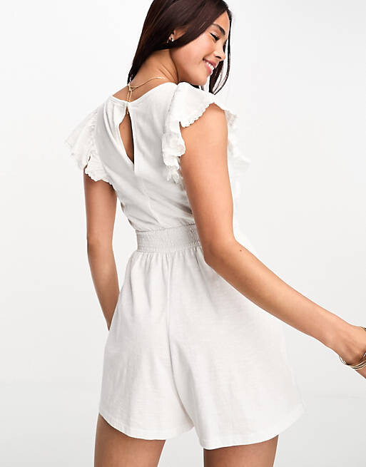 

Белый комбинезон с вырезами и оборками Miss Selfridge