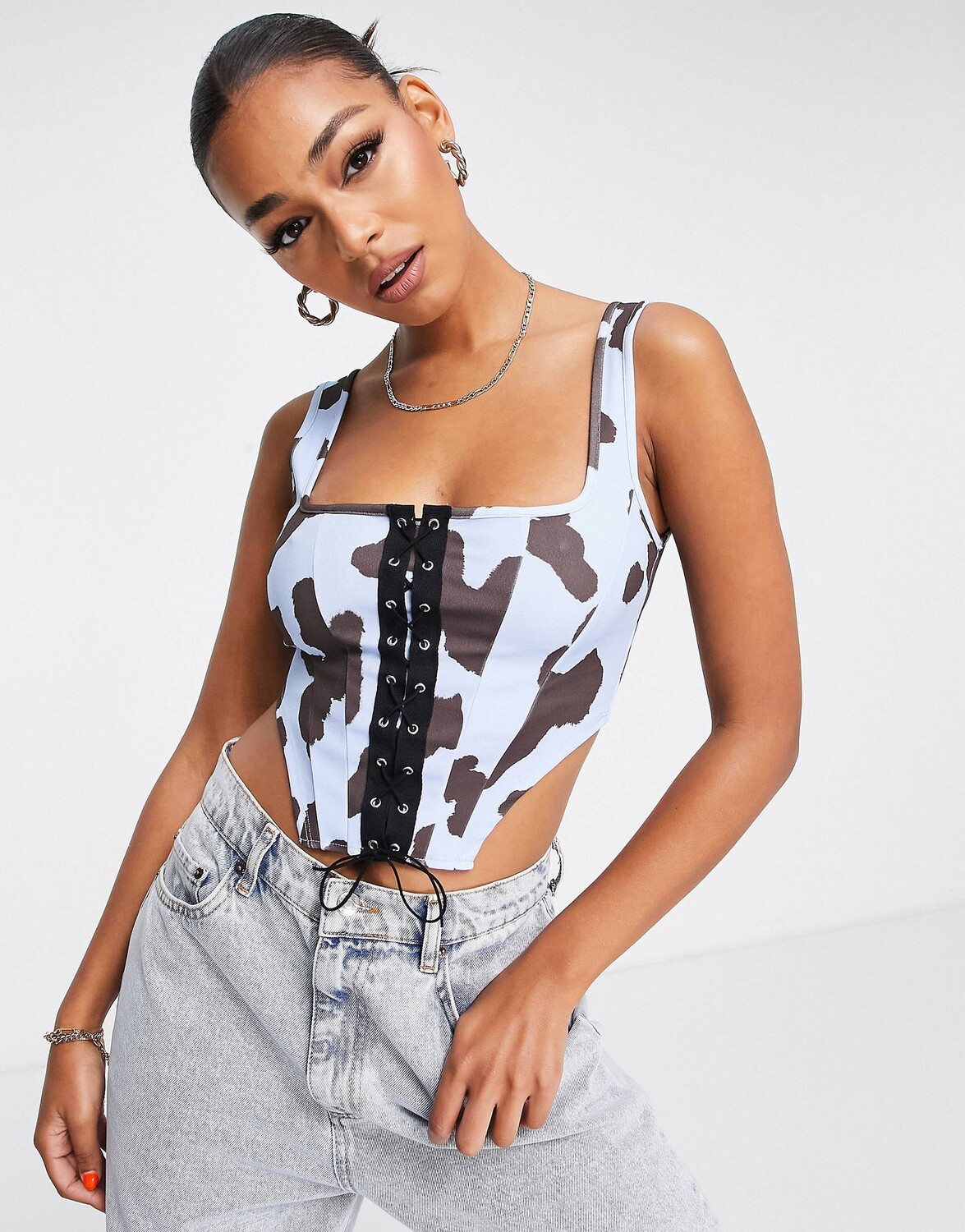

Корсетный топ в стиле вестерн со шнуровкой и коровьим принтом ASOS DESIGN
