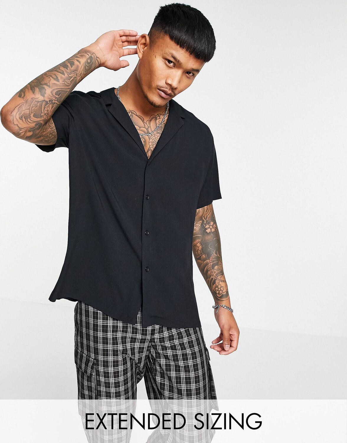 

Черная вискозная рубашка свободного кроя с низким воротником ASOS DESIGN