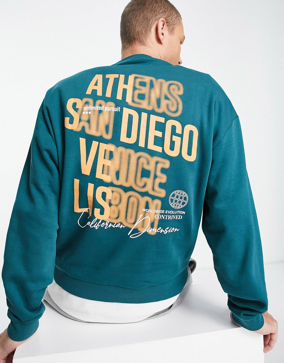 

Синяя толстовка оверсайз с принтом города на спине ASOS DESIGN