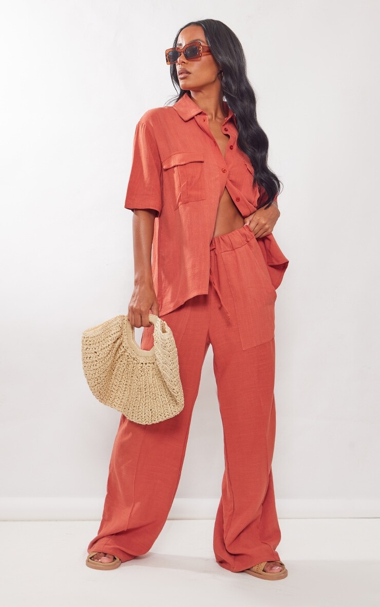 

PrettyLittleThing Ржавые широкие брюки с карманами и льняным эффектом спереди