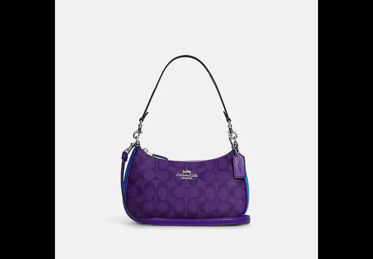 

Сумка Coach Teri Shoulder In Blocked Signature Canvas, фиолетовый