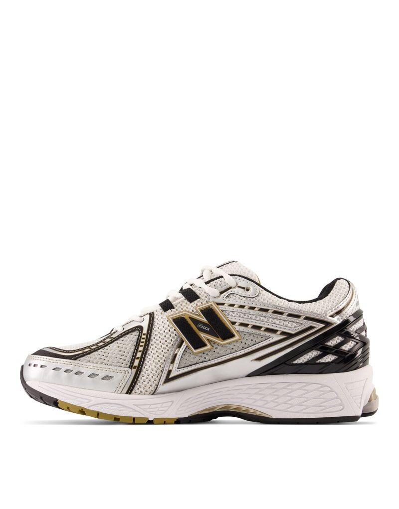 

Кроссовки New Balance 1906 золотого и черного цвета