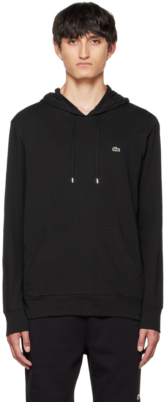 

Худи черного цвета с нашивками Lacoste